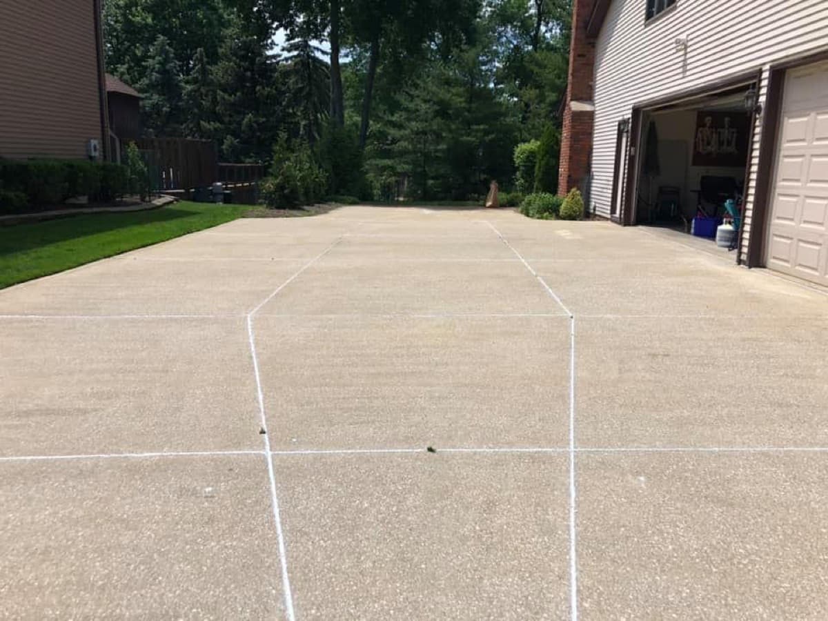 Long driveway with freshly caulked joints