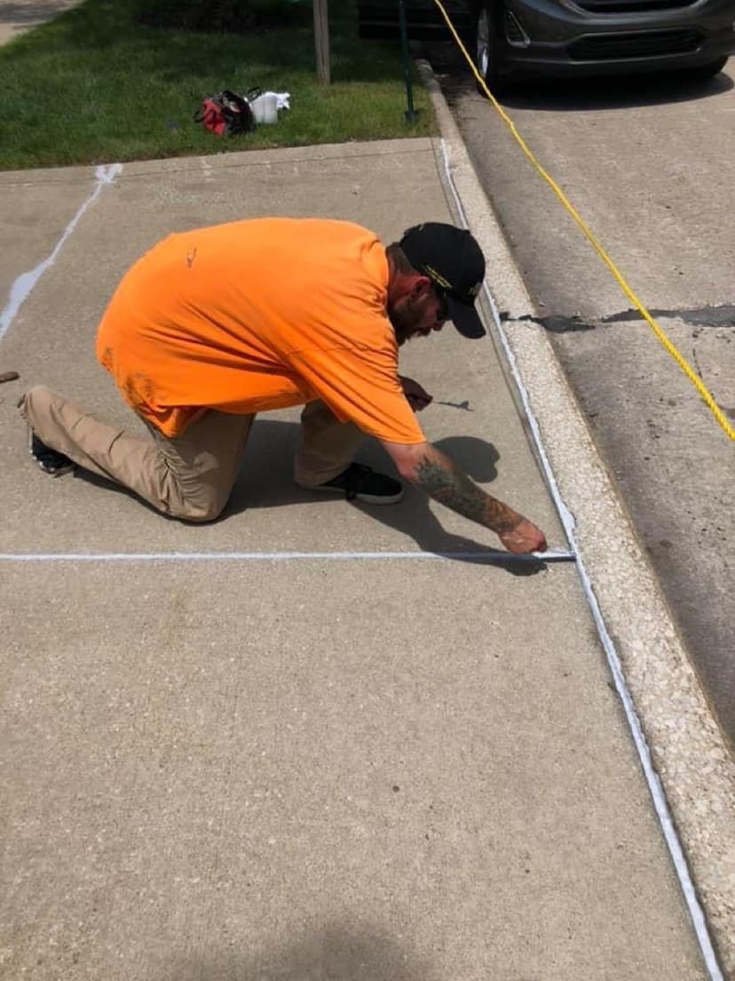 Tooling a driveway caulking joint